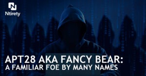 Hooded figures with computers.