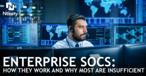 Man sitting at computer in security center.